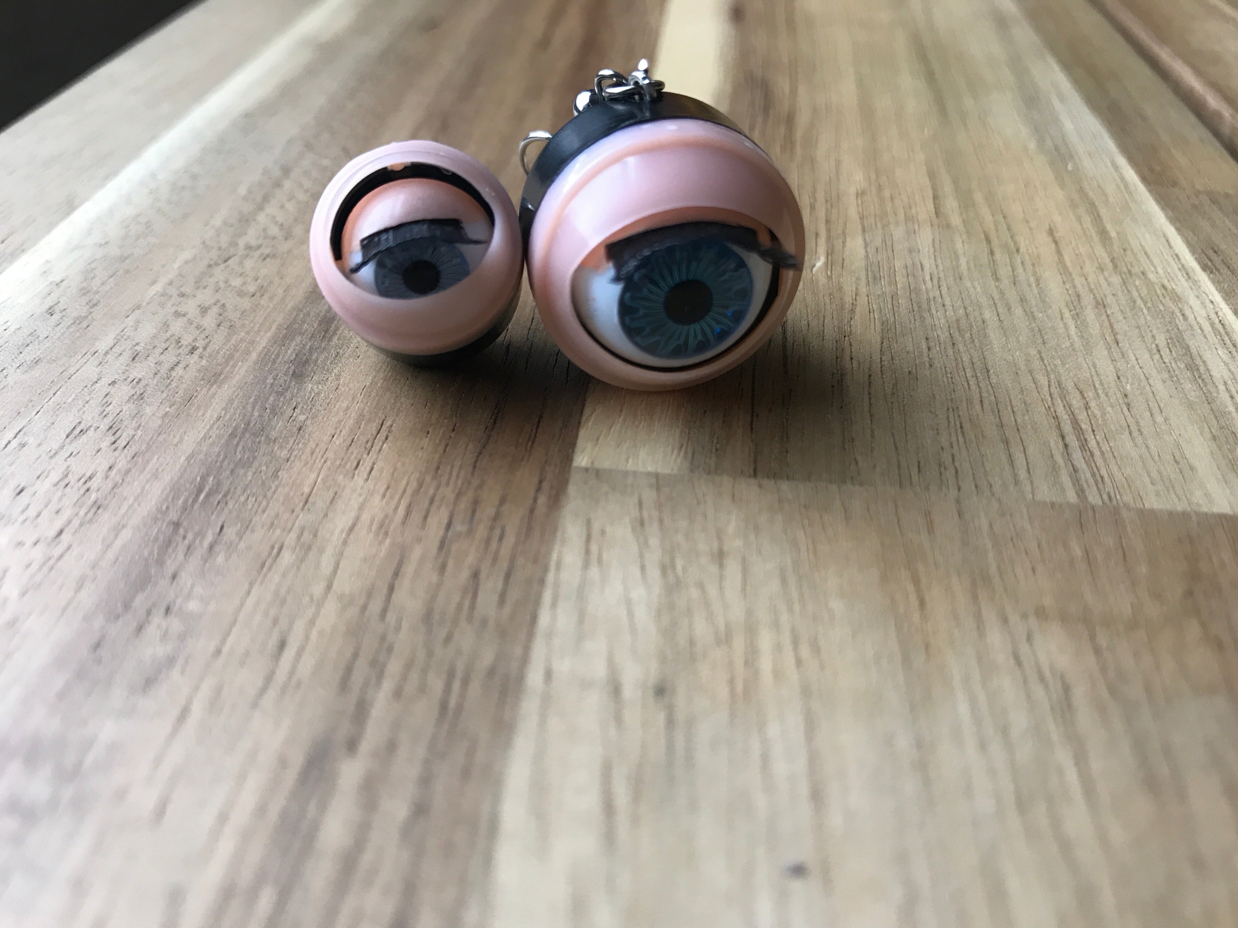 The small and large eyeballs sit next to each other for a handy size comparison. 